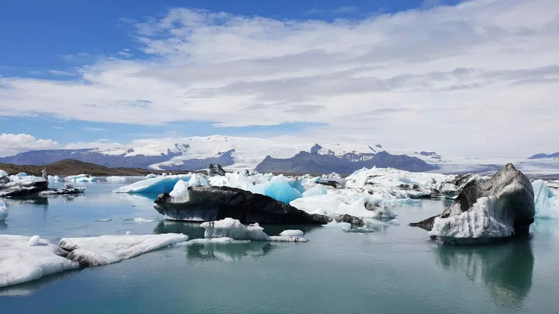 Amphibious boat with passengers among icebergs on a Jökulsárlón glacier lagoon boat tour in South East Iceland
