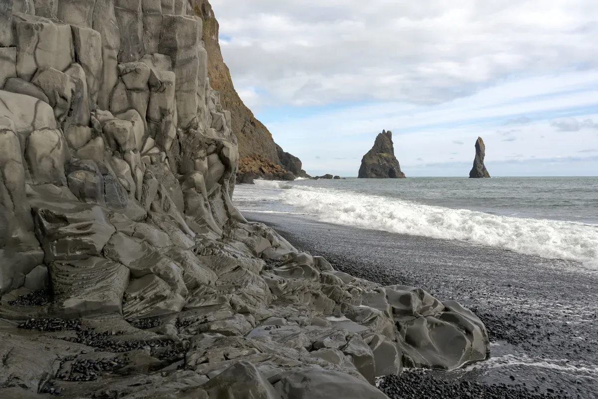 Reynisdrangar sea stacks from Reynisfjara, on a two-day south coast and Jökulsárlón boat tour